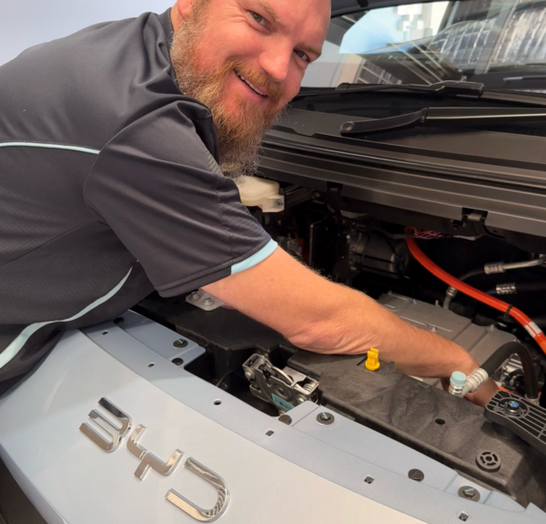 Qualified automotive engineer and EV specialist working on BYD electric vehicle.