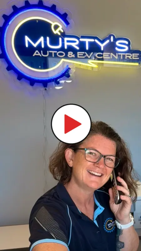 Photo of co-owner of Murty's Auto & EV Centre in West Caloundra answering the phone 